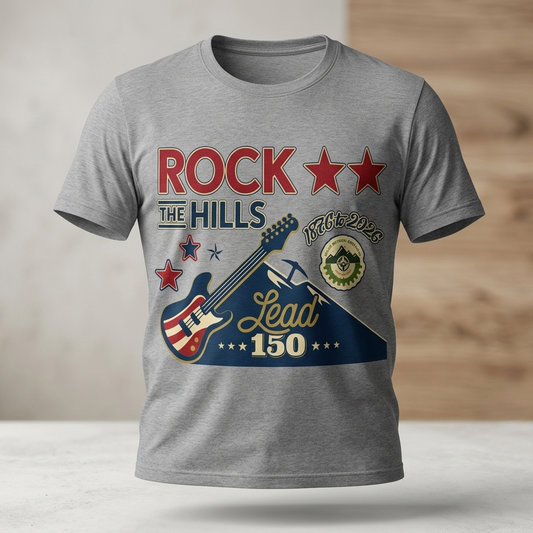 Gray t-shirt with a graphic design featuring a guitar and text on a wooden surface.