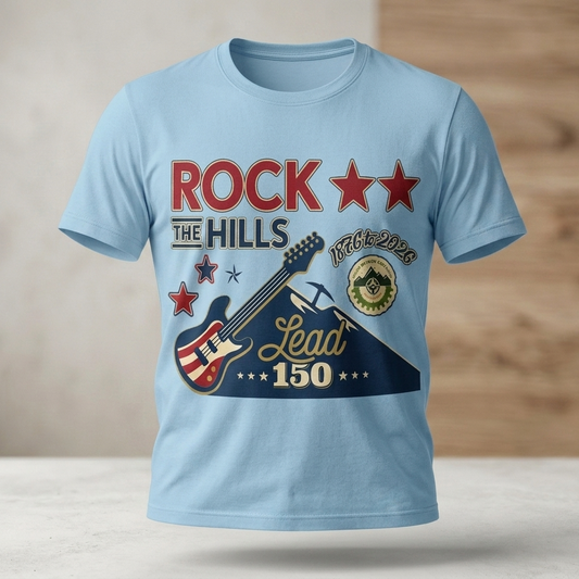 Light blue t-shirt with a guitar graphic and text on a wooden surface